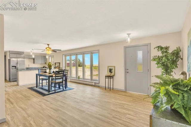 a living room with furniture window and wooden floor
