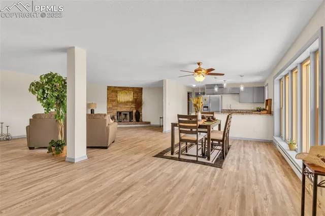a view of a livingroom with furniture and a window