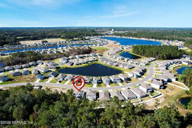 an aerial view of residential houses with outdoor space