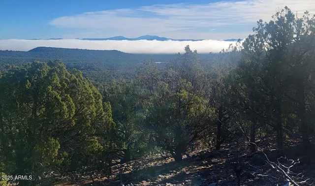a view of mountain view with mountains in the background