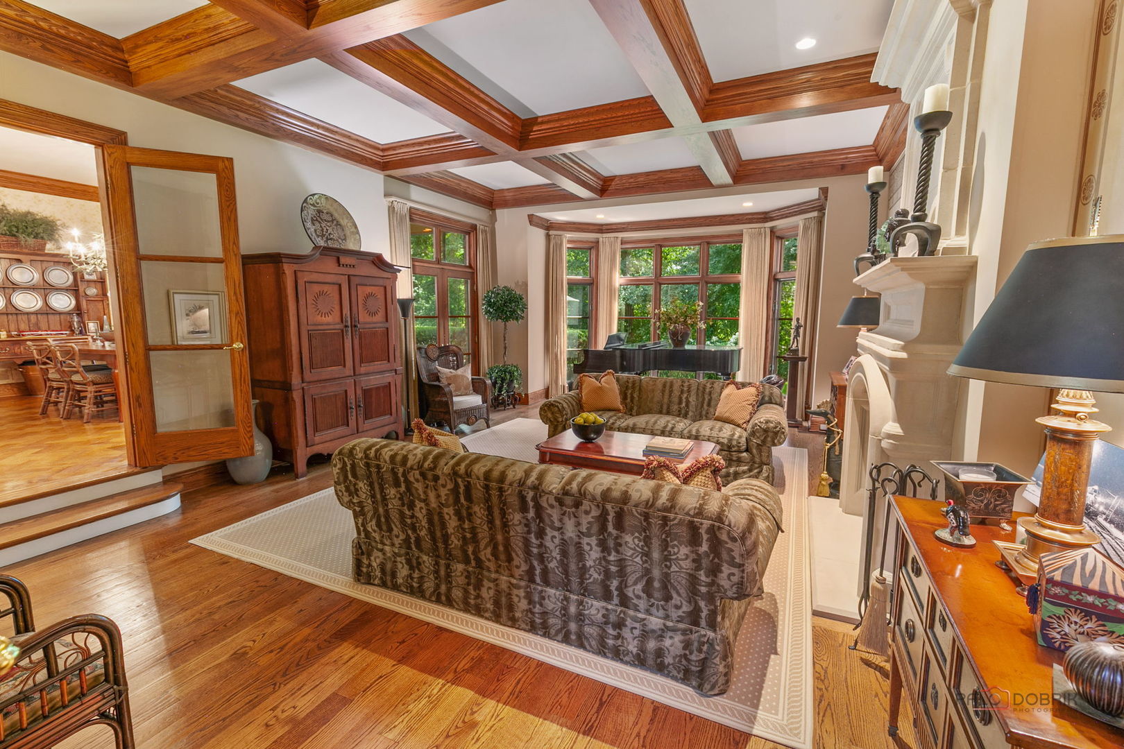 1271 North Green Bay Road Lake Forest, IL 60045 - Photo 16 of 57 a living room with furniture a flat screen tv and floor to ceiling window