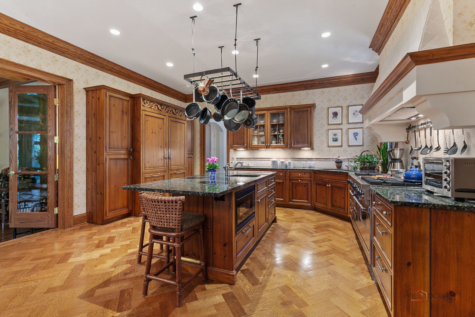 1271 North Green Bay Road Lake Forest, IL 60045 - Photo 17 of 57 a kitchen with stainless steel appliances granite countertop a sink a stove and a wooden floors