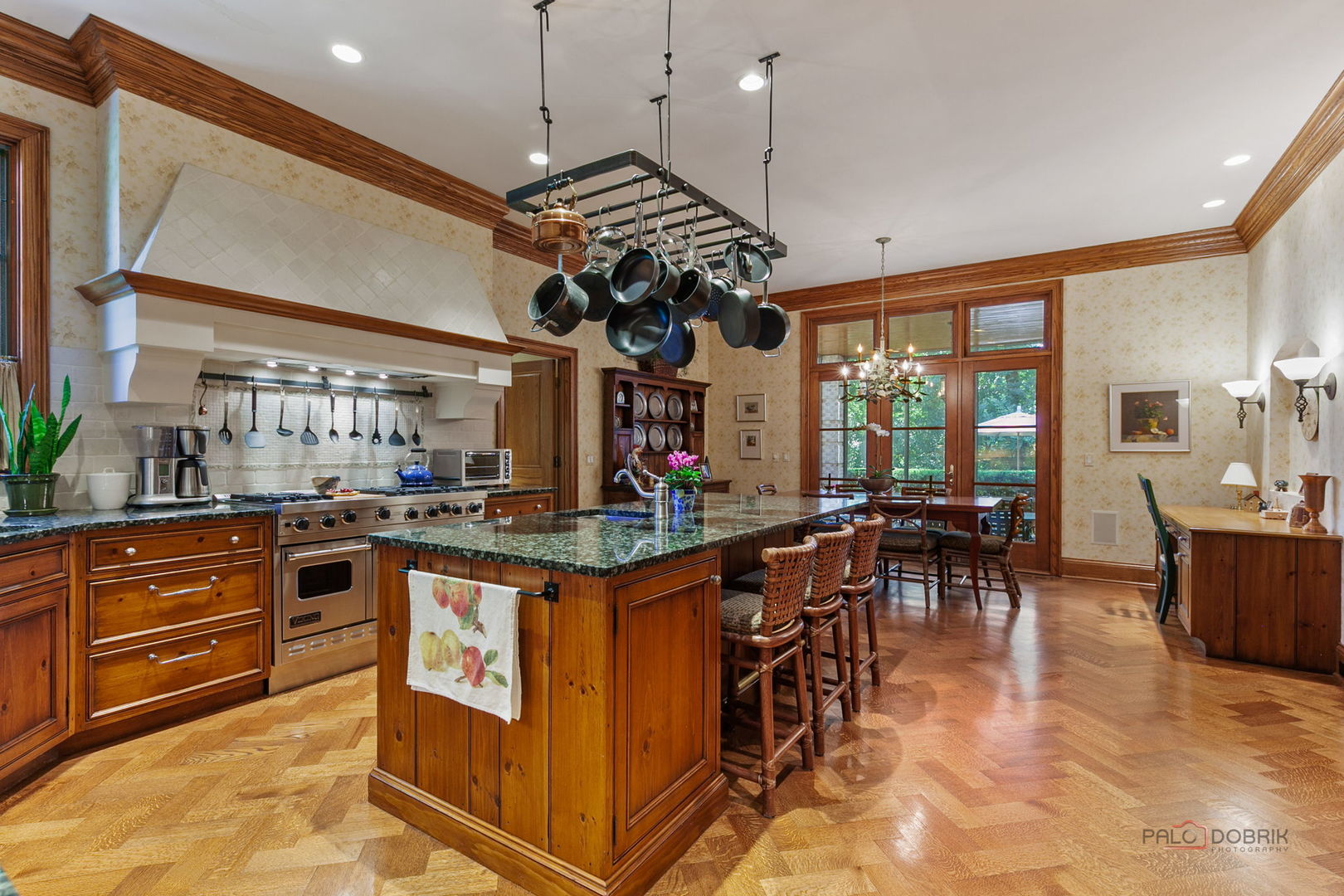 1271 North Green Bay Road Lake Forest, IL 60045 - Photo 18 of 57 a kitchen with stainless steel appliances granite countertop a stove and a view of dining table