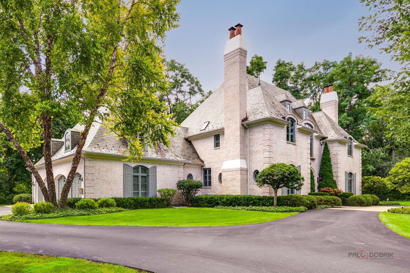 1271 North Green Bay Road Lake Forest, IL 60045 - Photo 2 of 57 a front view of a house with a yard and garage