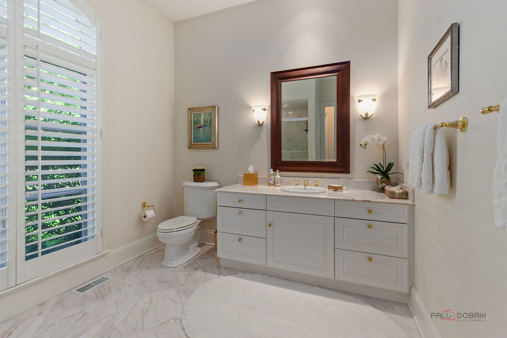 1271 North Green Bay Road Lake Forest, IL 60045 - Photo 27 of 57 a bathroom with a toilet a sink a mirror and a window