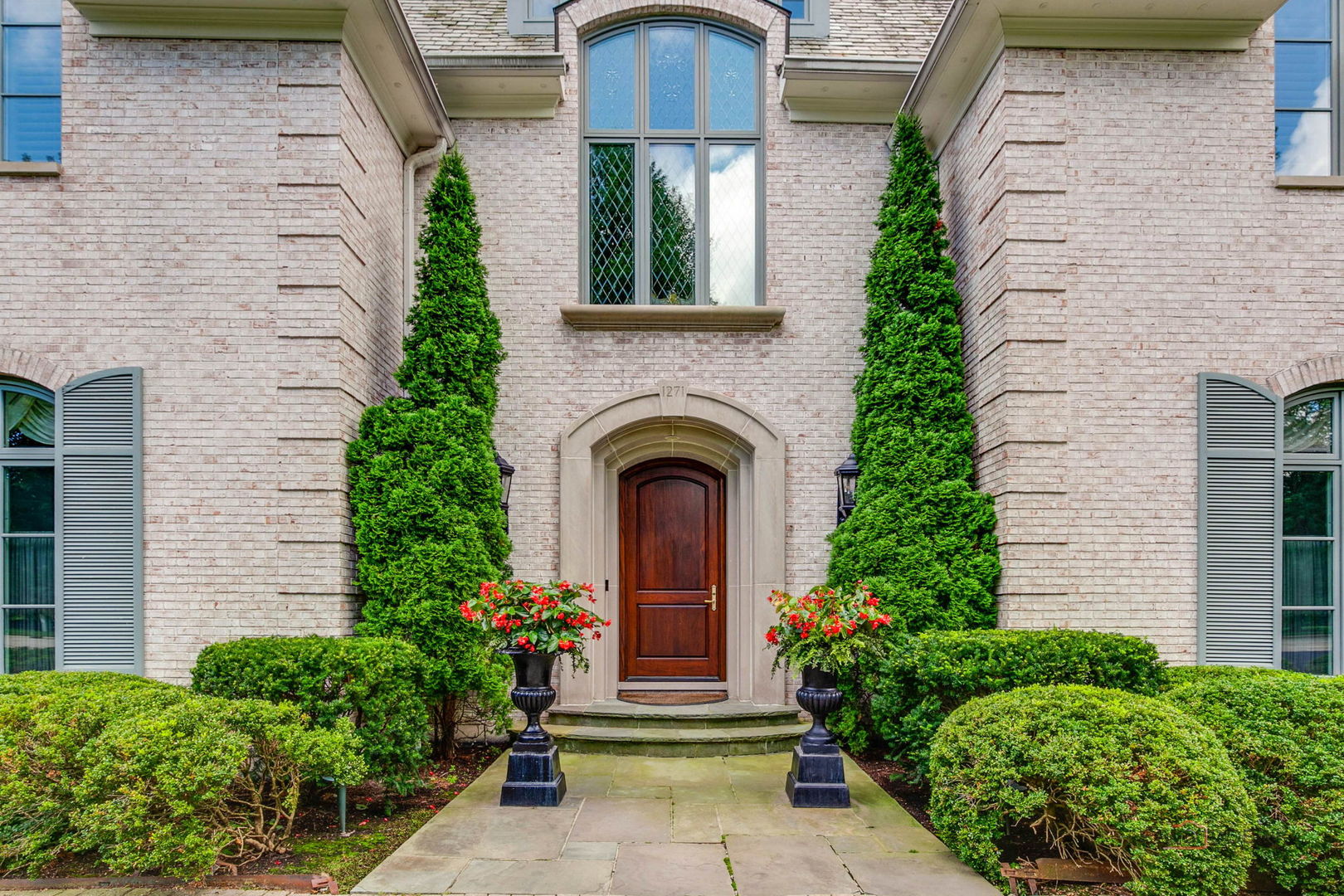 1271 North Green Bay Road Lake Forest, IL 60045 - Photo 3 of 57 front view of a house with potted plants
