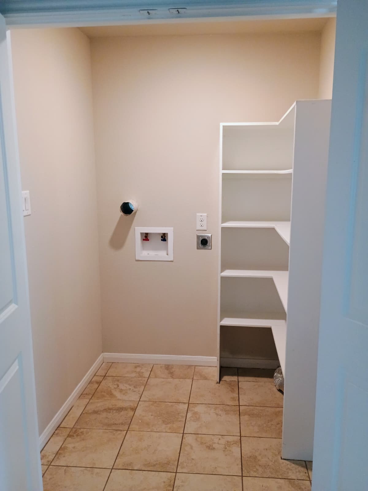 14945 Austin Road Willis, TX 77378 - Photo 4 of 13 pantry and the washroom