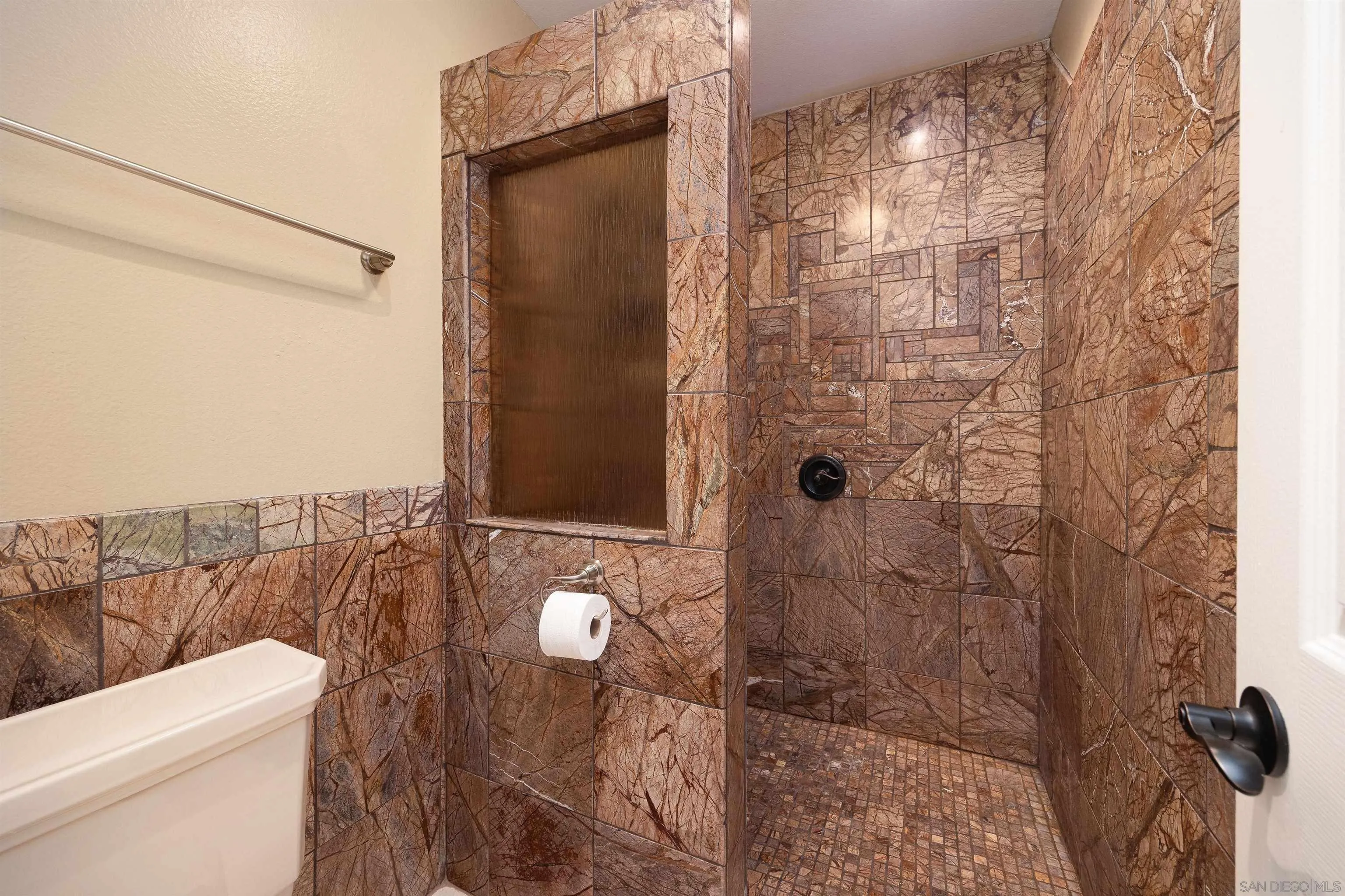 7700 Parkway Drive, Unit 4 La Mesa, CA 91942 - Photo 13 of 23 a bathroom with a shower and toilet