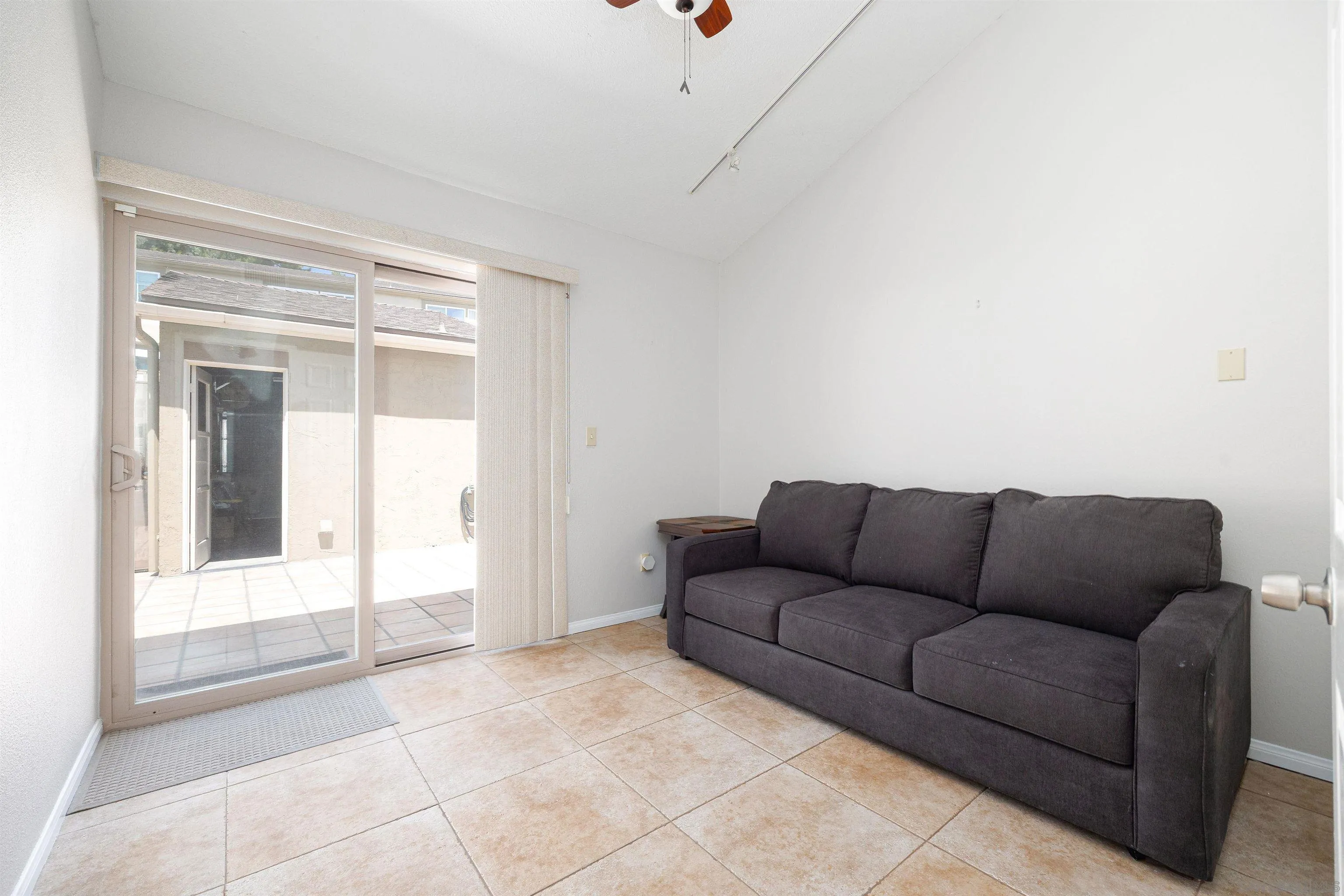 7700 Parkway Drive, Unit 4 La Mesa, CA 91942 - Photo 15 of 23 a living room with furniture and a window