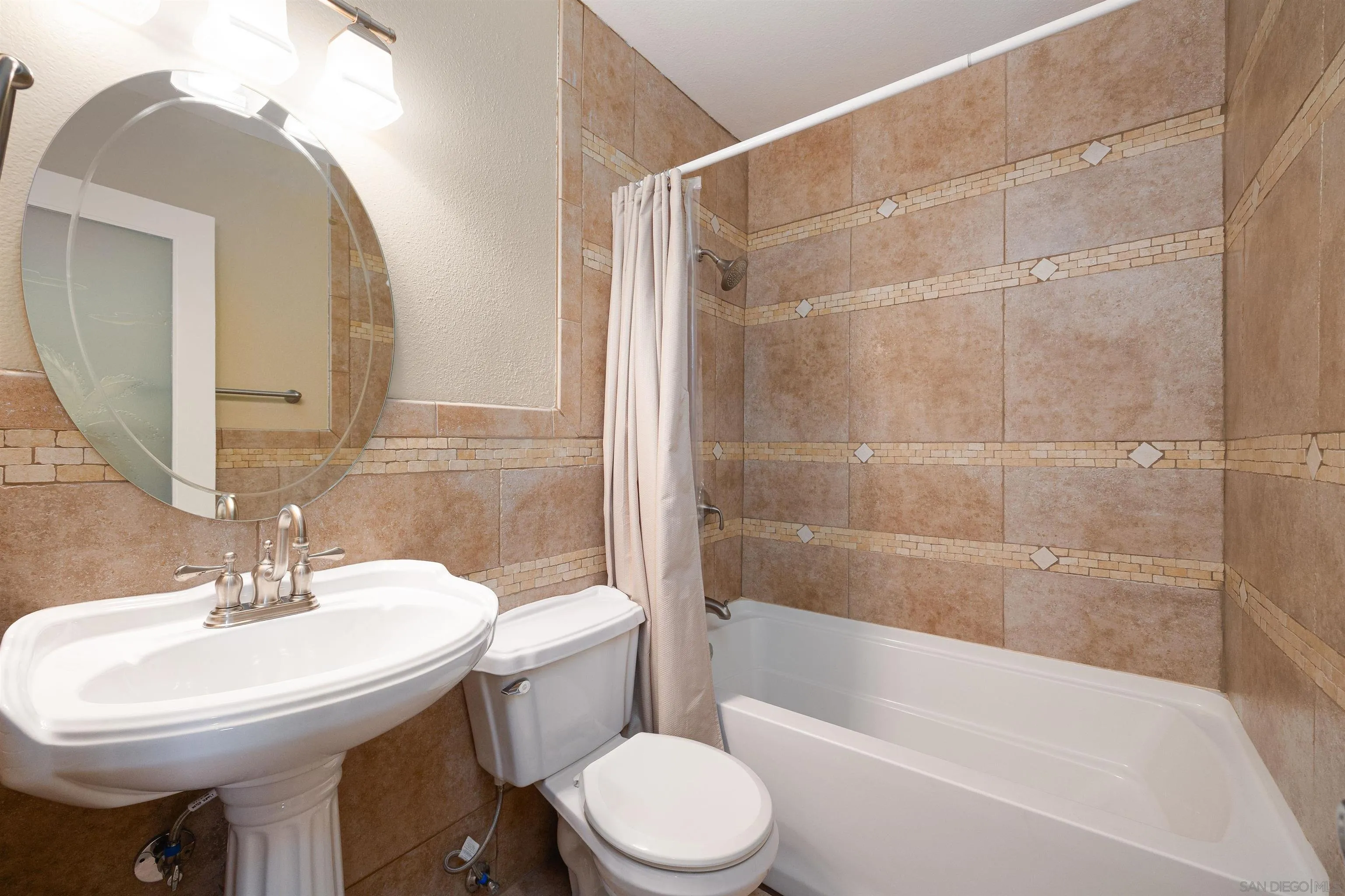 7700 Parkway Drive, Unit 4 La Mesa, CA 91942 - Photo 16 of 23 a bathroom with a sink toilet and shower