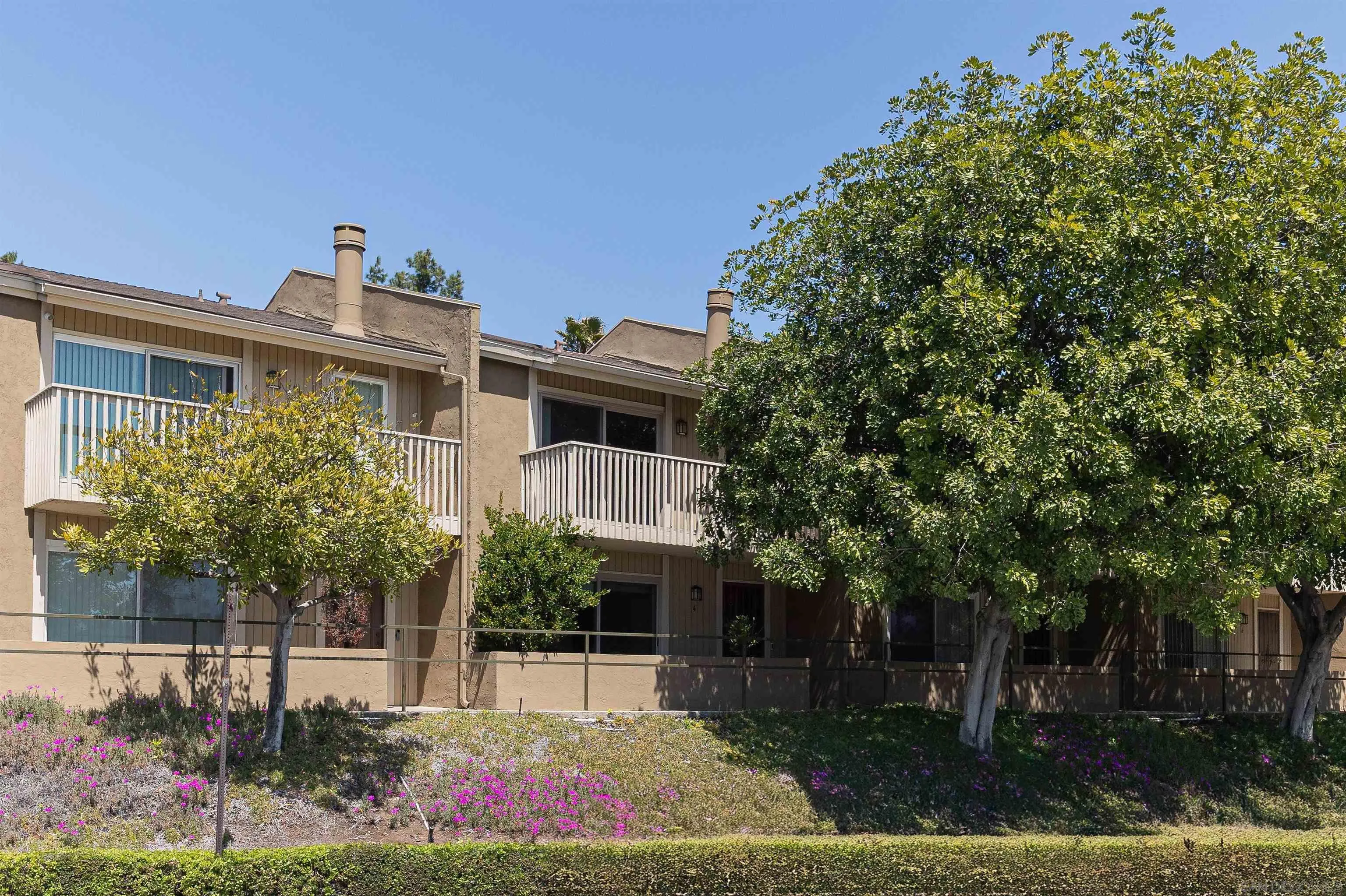 7700 Parkway Drive, Unit 4 La Mesa, CA 91942 - Photo 19 of 23 a front view of a house with garden