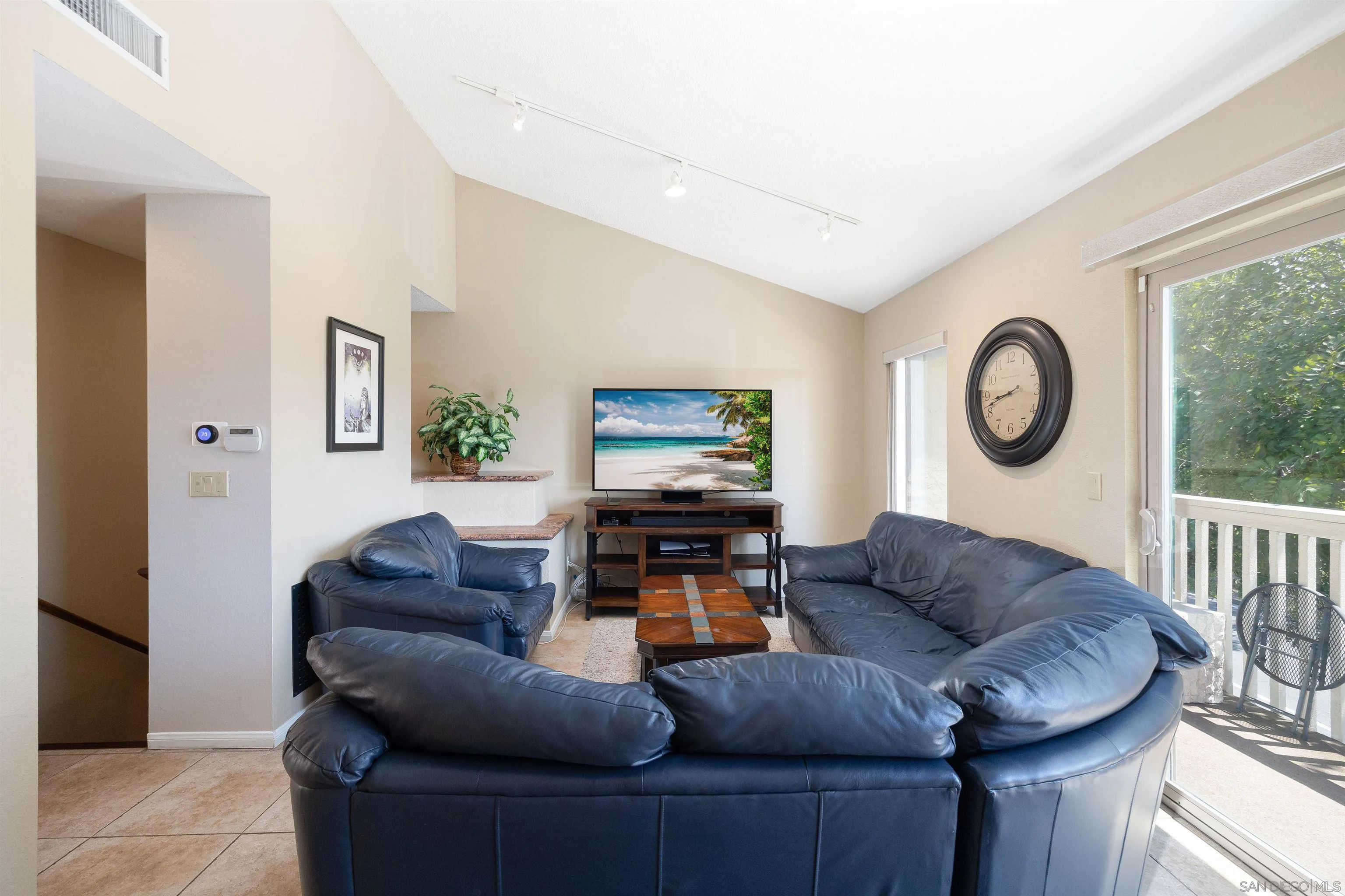 7700 Parkway Drive, Unit 4 La Mesa, CA 91942 - Photo 5 of 23 a living room with furniture and a wooden floor
