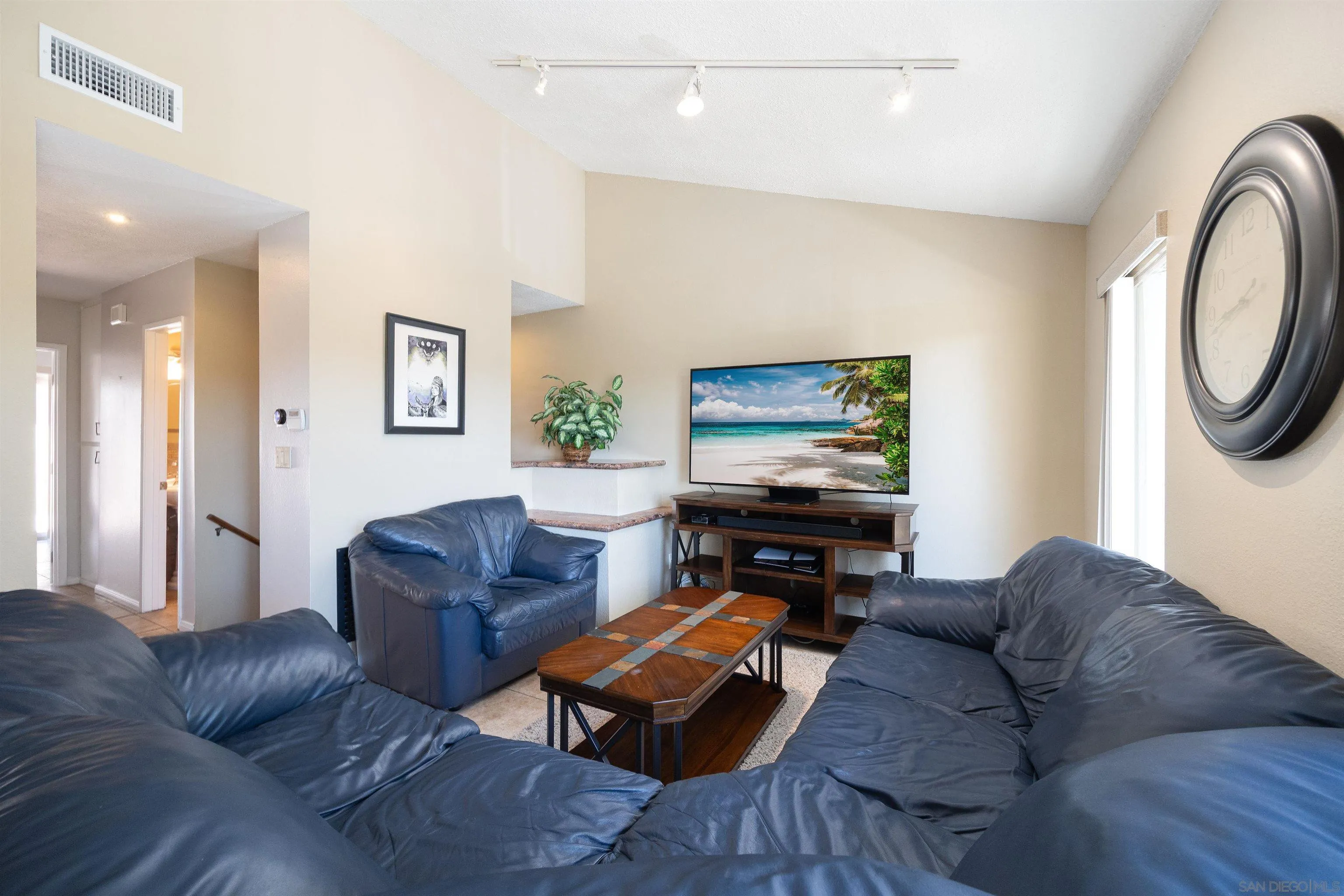 7700 Parkway Drive, Unit 4 La Mesa, CA 91942 - Photo 6 of 23 a living room with furniture and a wooden floor