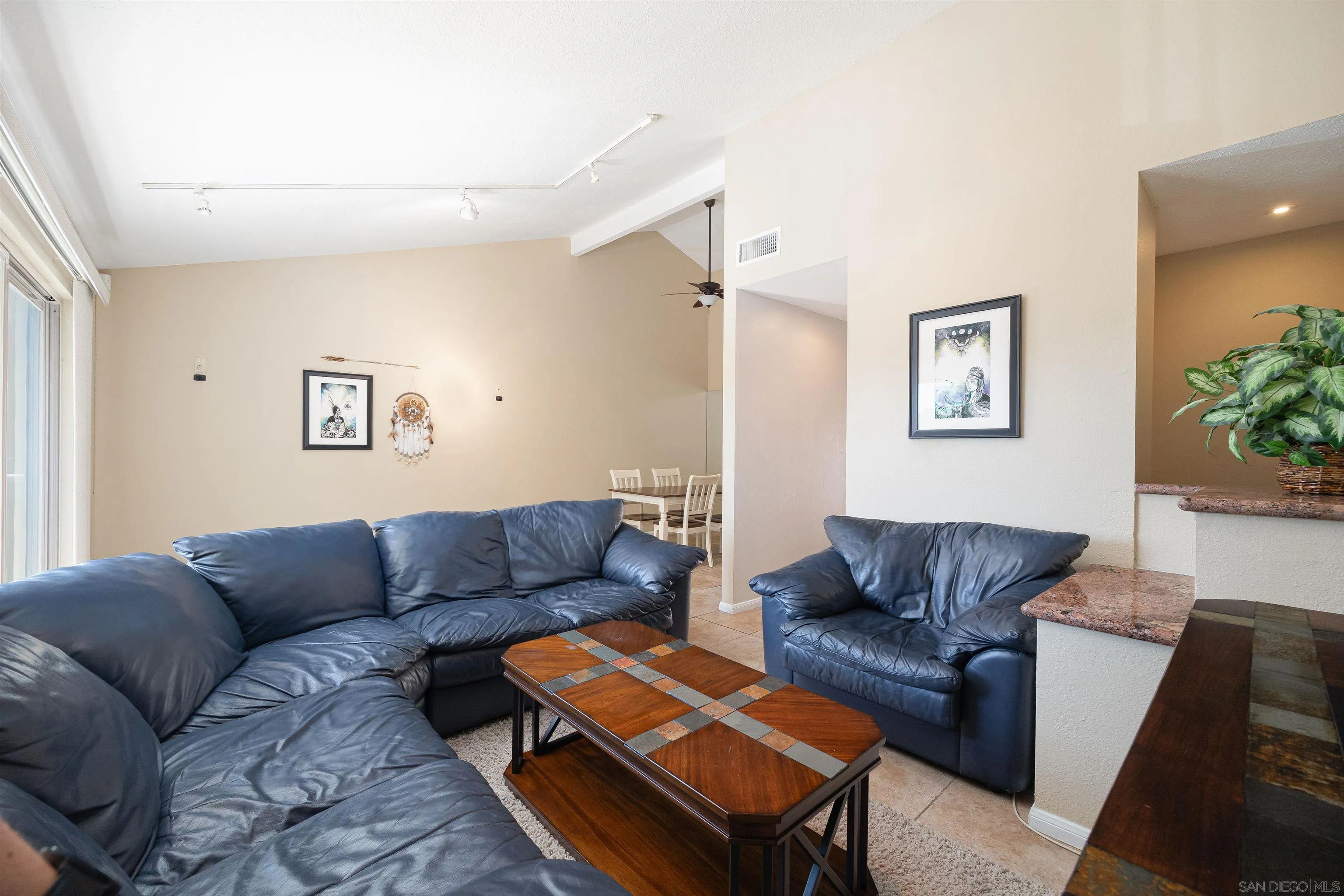 7700 Parkway Drive, Unit 4 La Mesa, CA 91942 - Photo 7 of 23 a living room with furniture and a couch