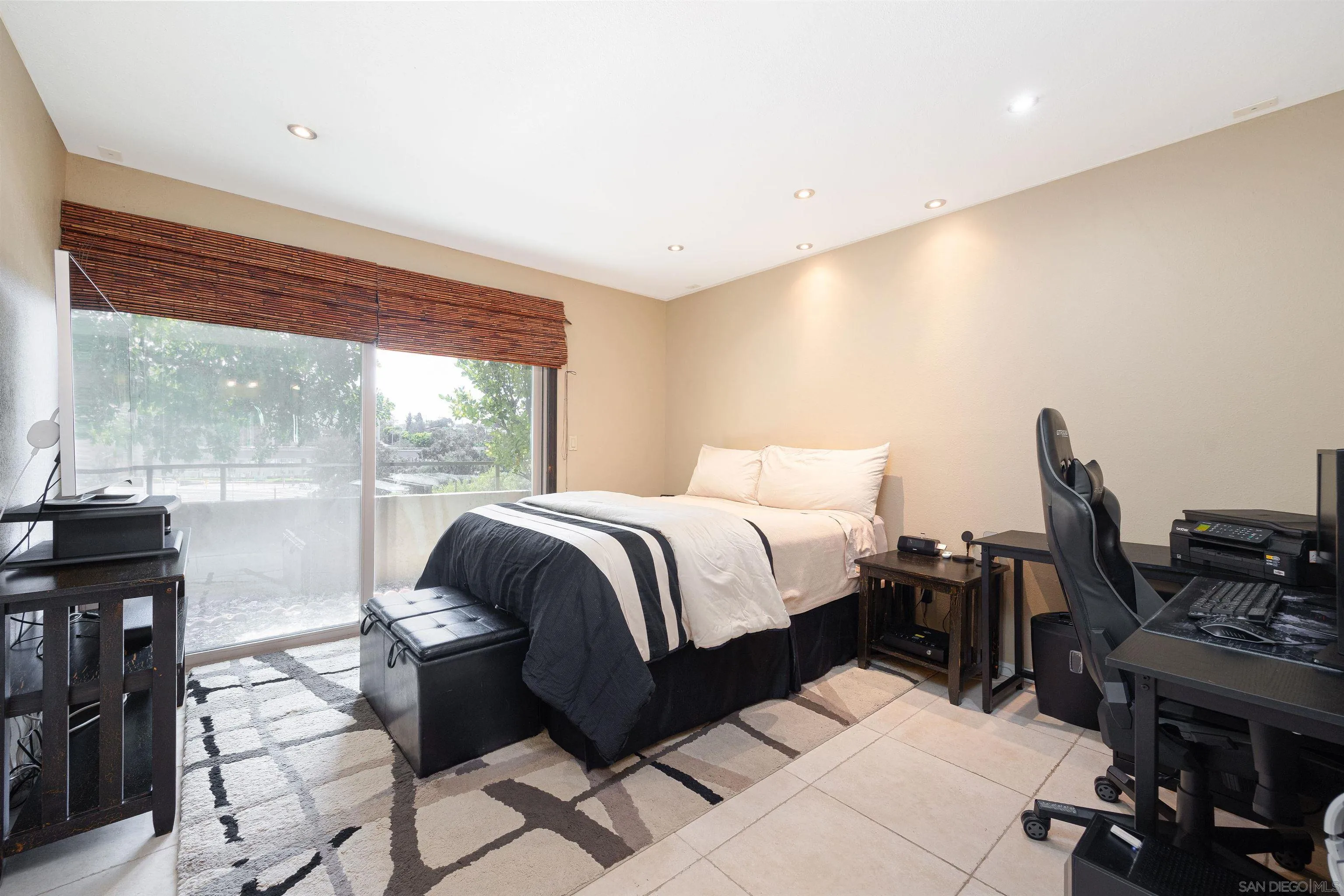 7700 Parkway Drive, Unit 4 La Mesa, CA 91942 - Photo 10 of 23 a bedroom with a bed and wooden floor