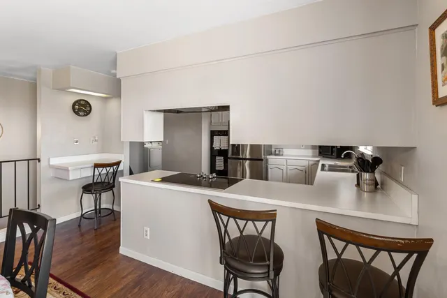 a dining room with a table chairs and a wooden floor