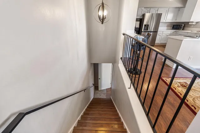 a view of stairs with wooden floor