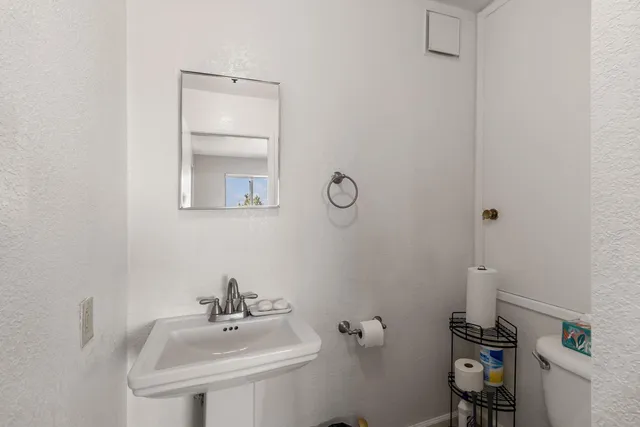 a bathroom with a sink and mirror