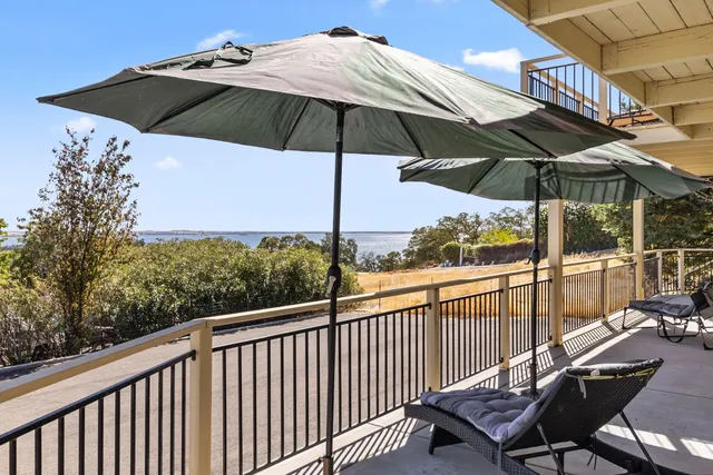 a view of a two chairs under an umbrella