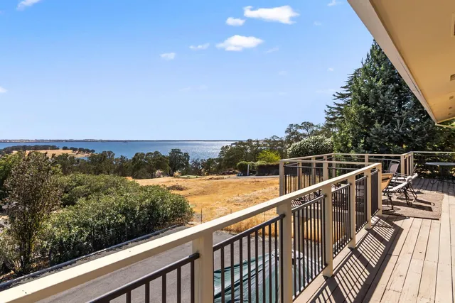 a view of a balcony with ocean view