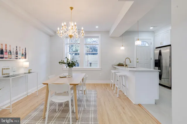 a view of a hallway with stairs and a couch