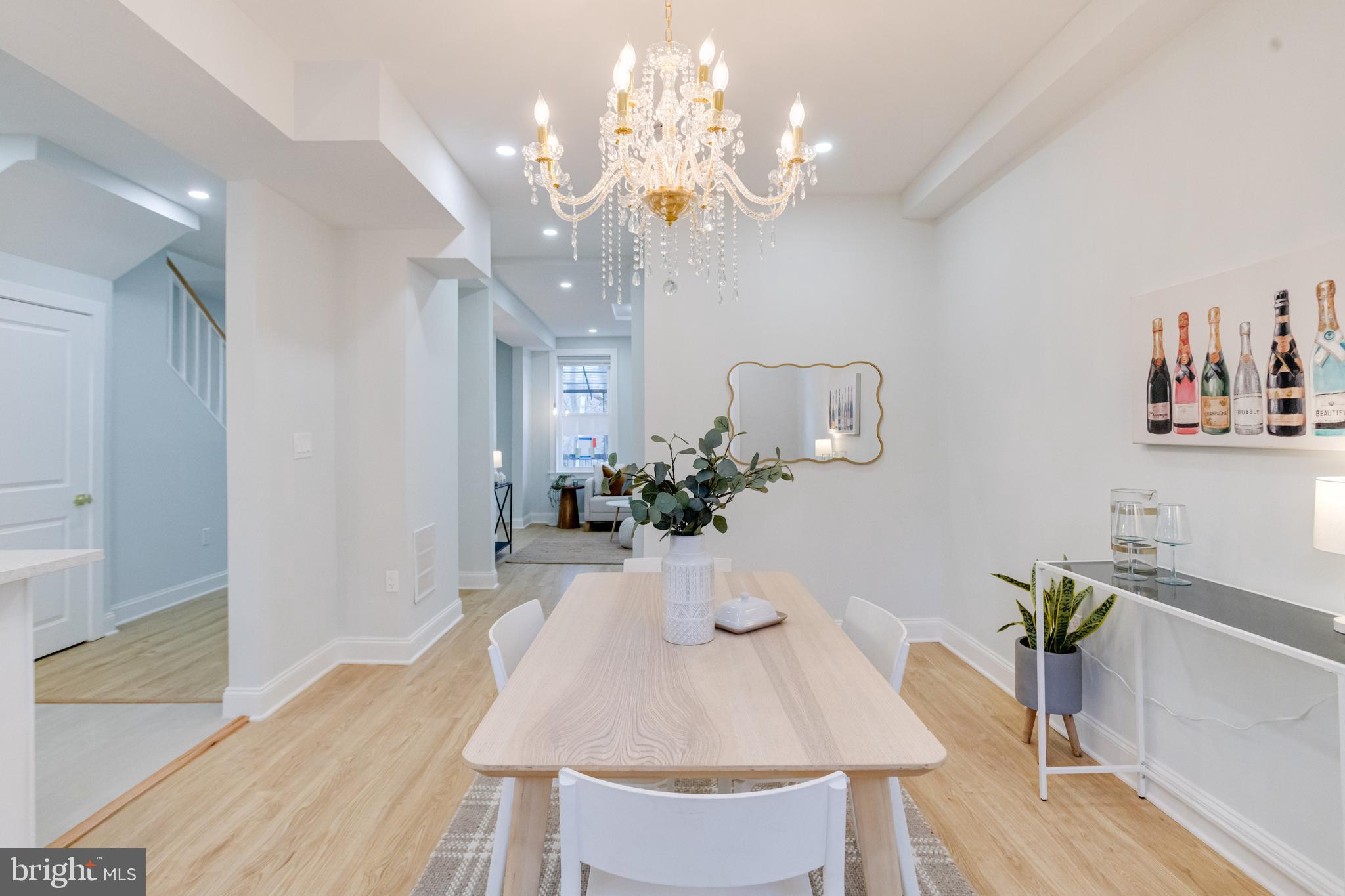 635 North Rosedale Street Baltimore, MD 21216 - Photo 14 of 64 a view of a dining room with furniture and chandelier