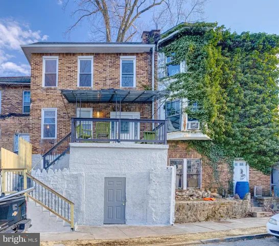a front view of a house with large windows