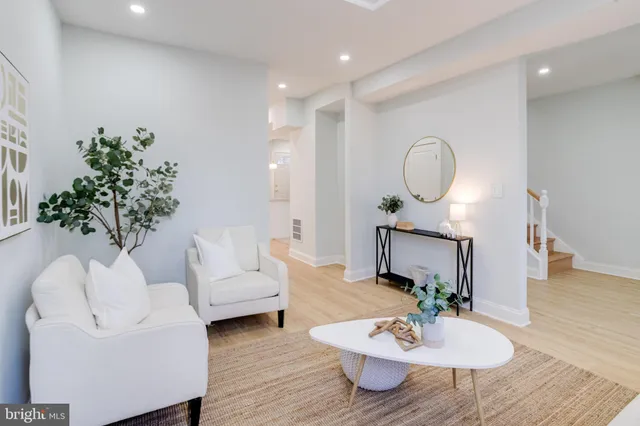 a spacious bedroom with a bed and a couch