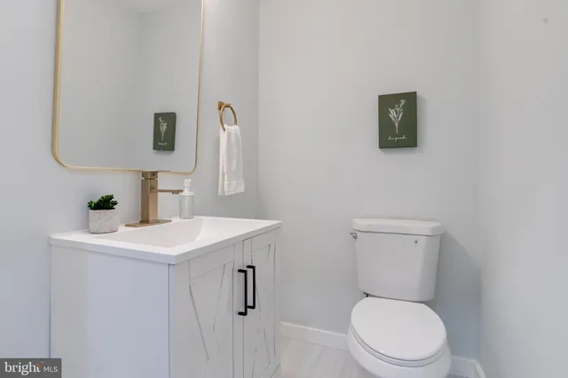 a large bed sitting in a bedroom next to a window