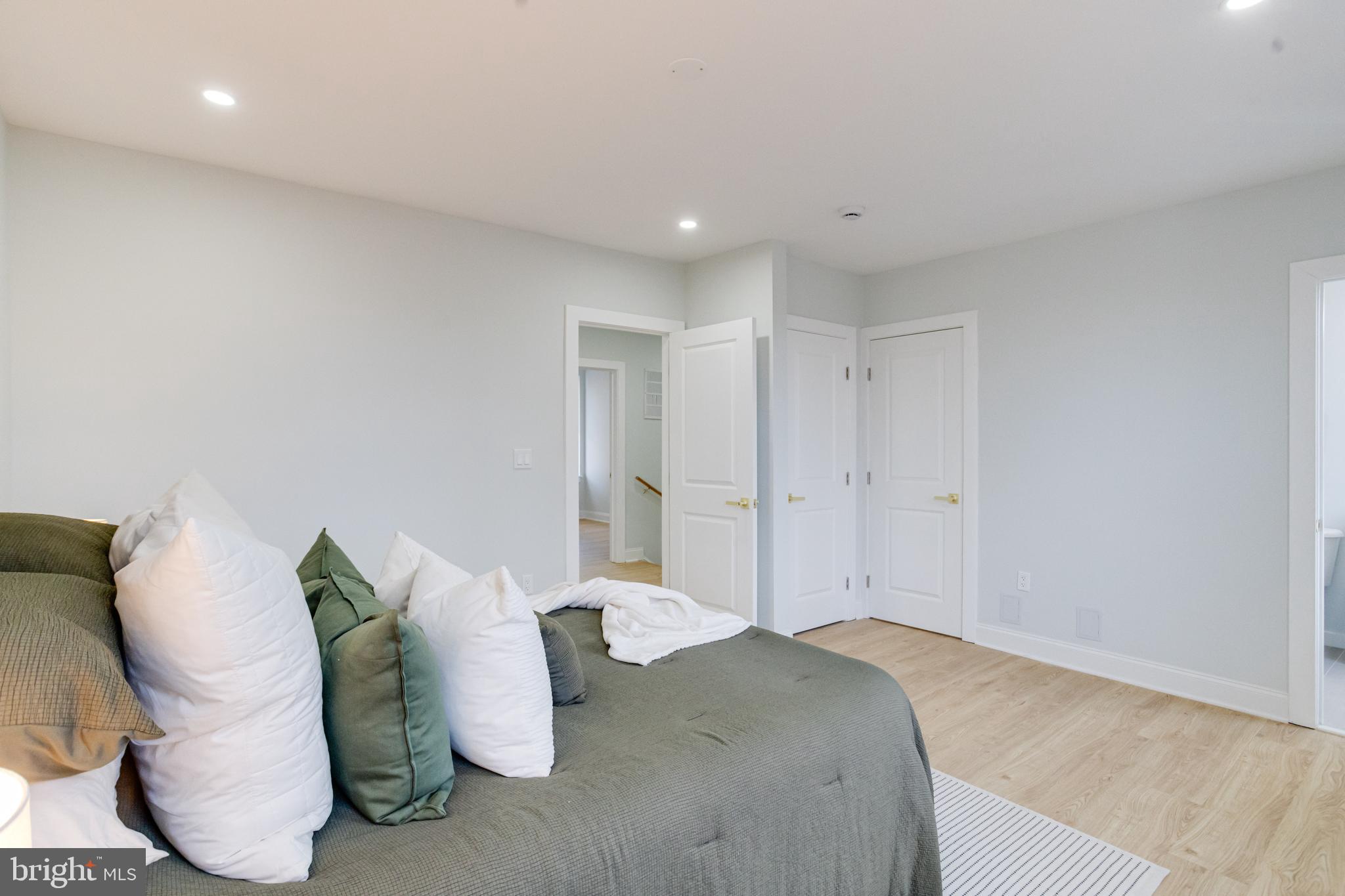 635 North Rosedale Street Baltimore, MD 21216 - Photo 27 of 64 a spacious bedroom with a bed and a couch