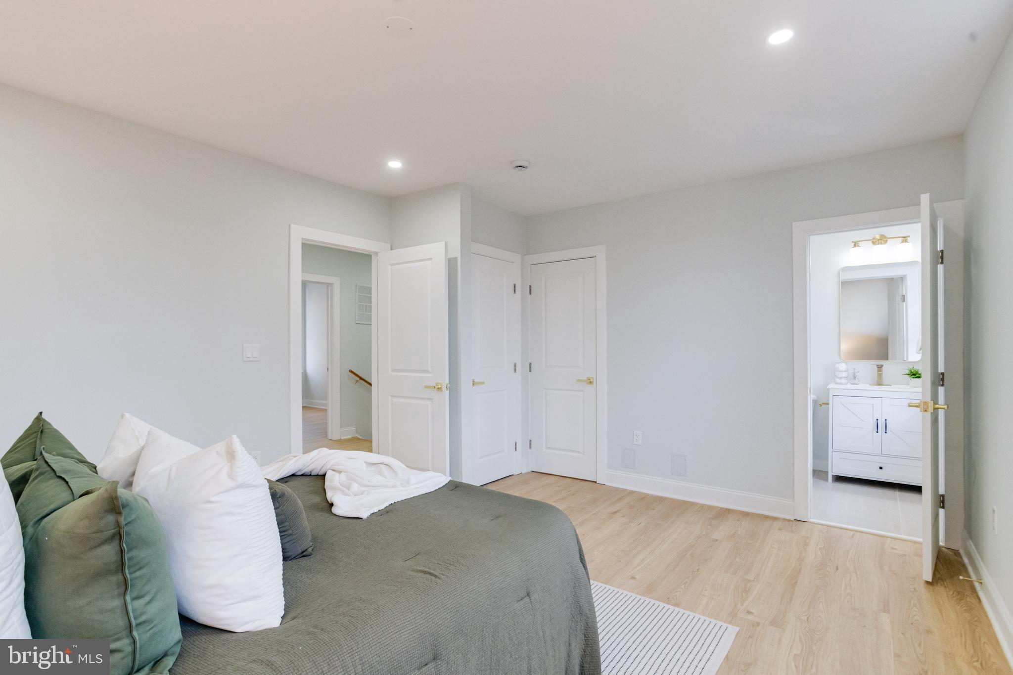 635 North Rosedale Street Baltimore, MD 21216 - Photo 29 of 64 a spacious bedroom with a bed and walk in closet