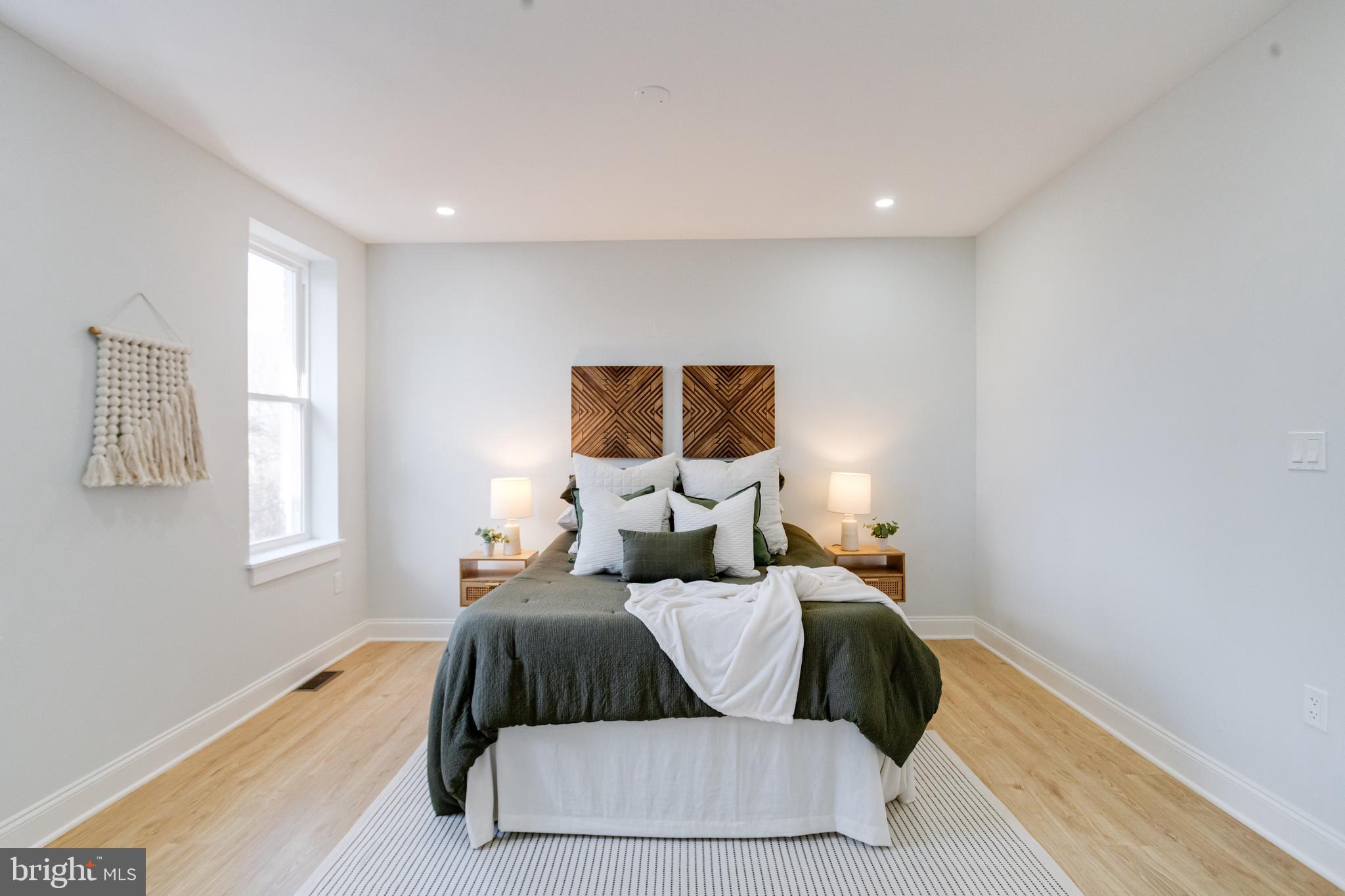 635 North Rosedale Street Baltimore, MD 21216 - Photo 31 of 64 a bedroom with a bed and window