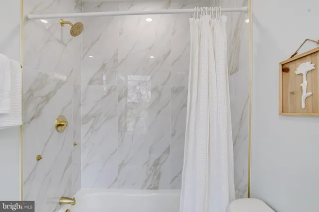 a view of a hallway with stairs