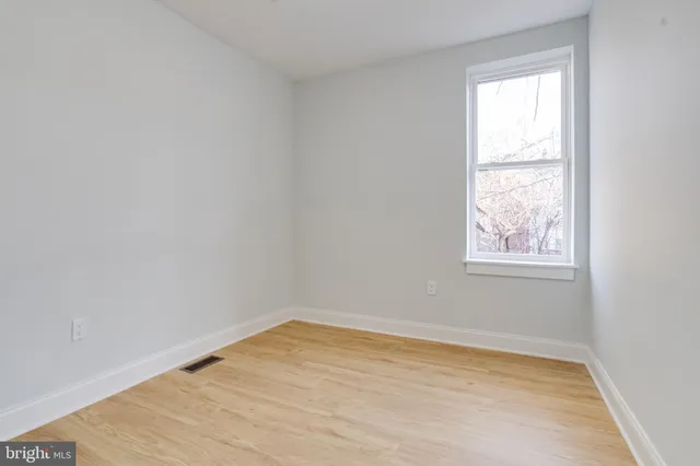 a view of balcony with two chairs and a barbeque