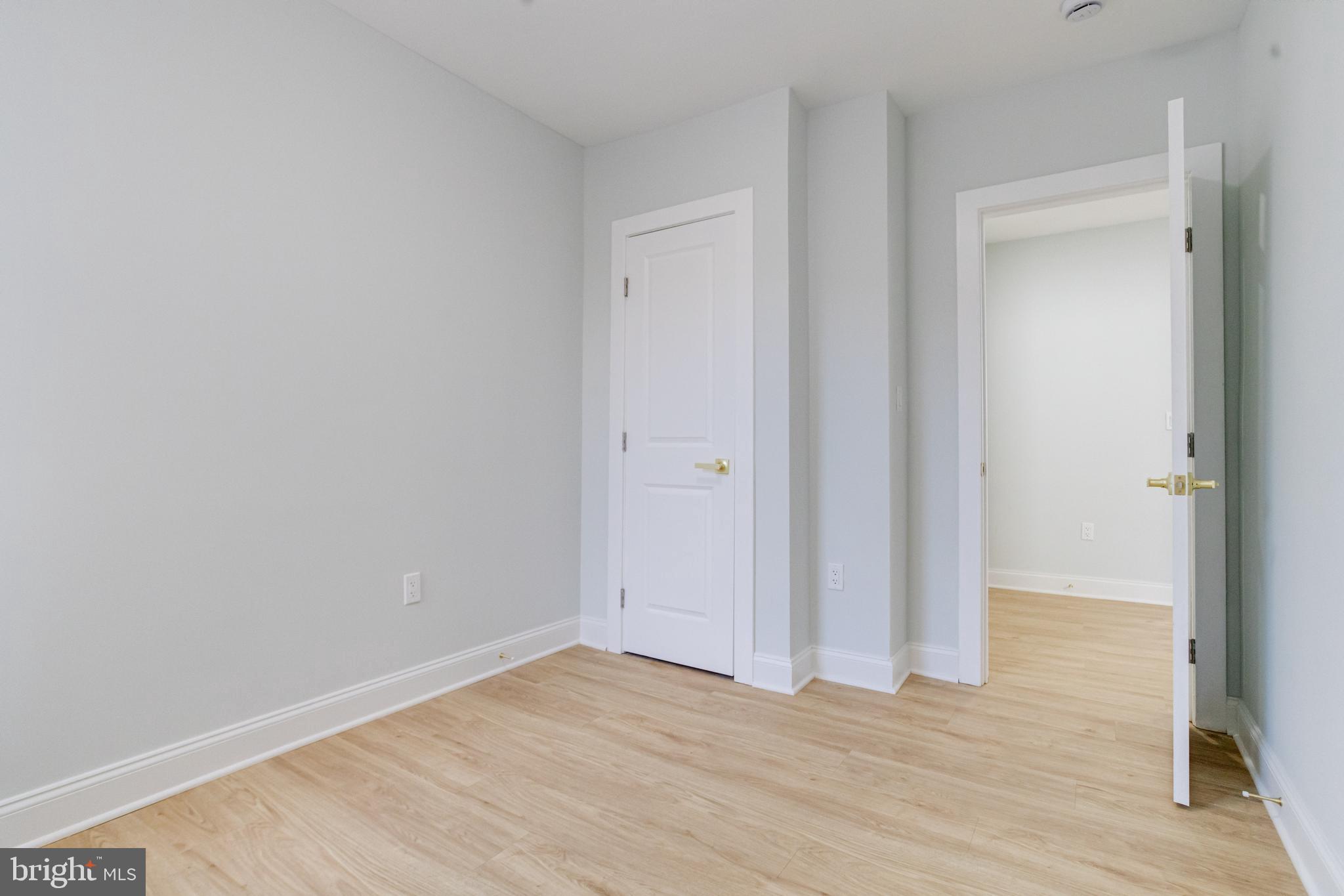 635 North Rosedale Street Baltimore, MD 21216 - Photo 45 of 64 a view of an empty room with wooden floor
