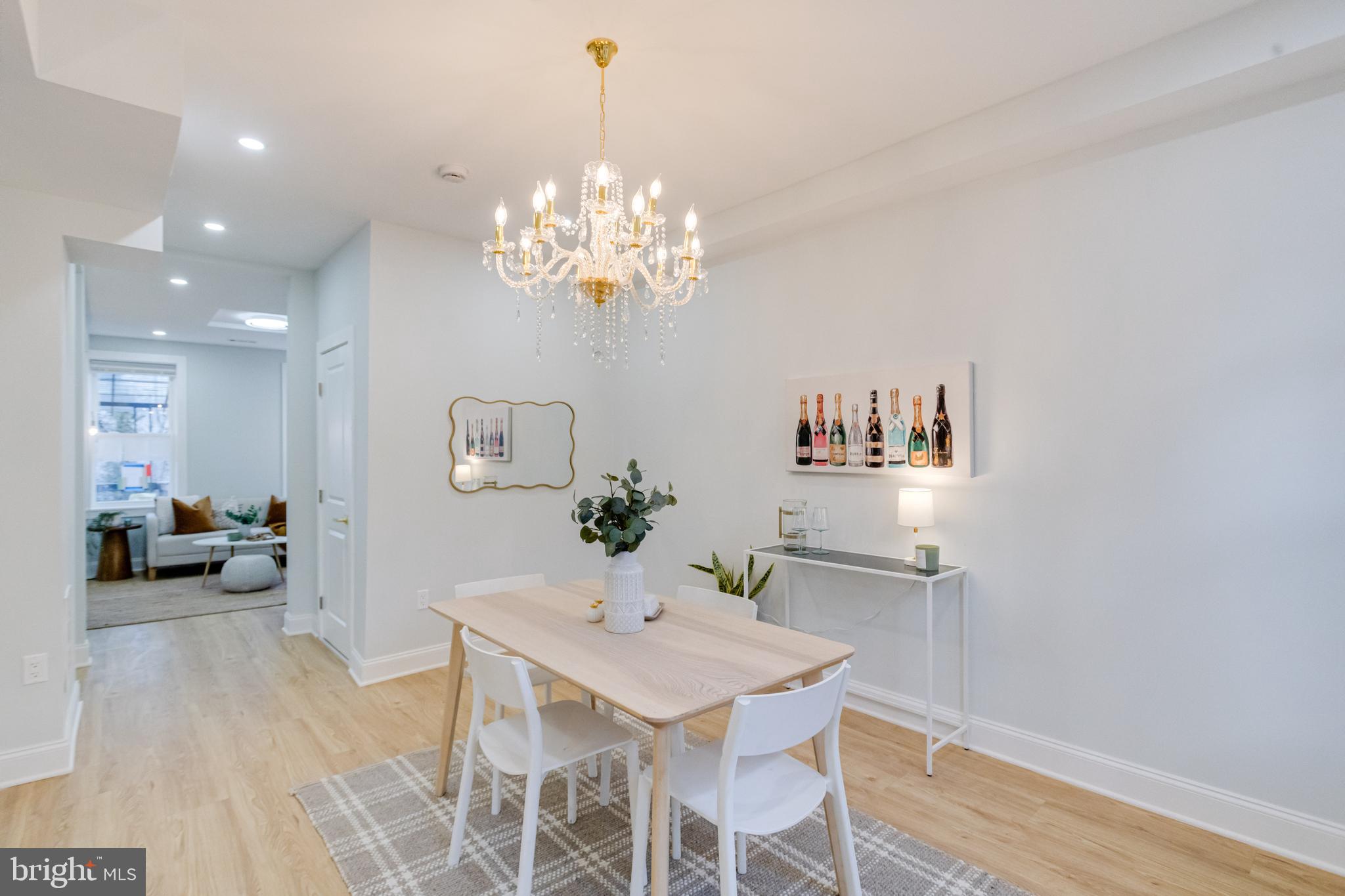 635 North Rosedale Street Baltimore, MD 21216 - Photo 10 of 64 a view of a dining room with furniture and chandelier