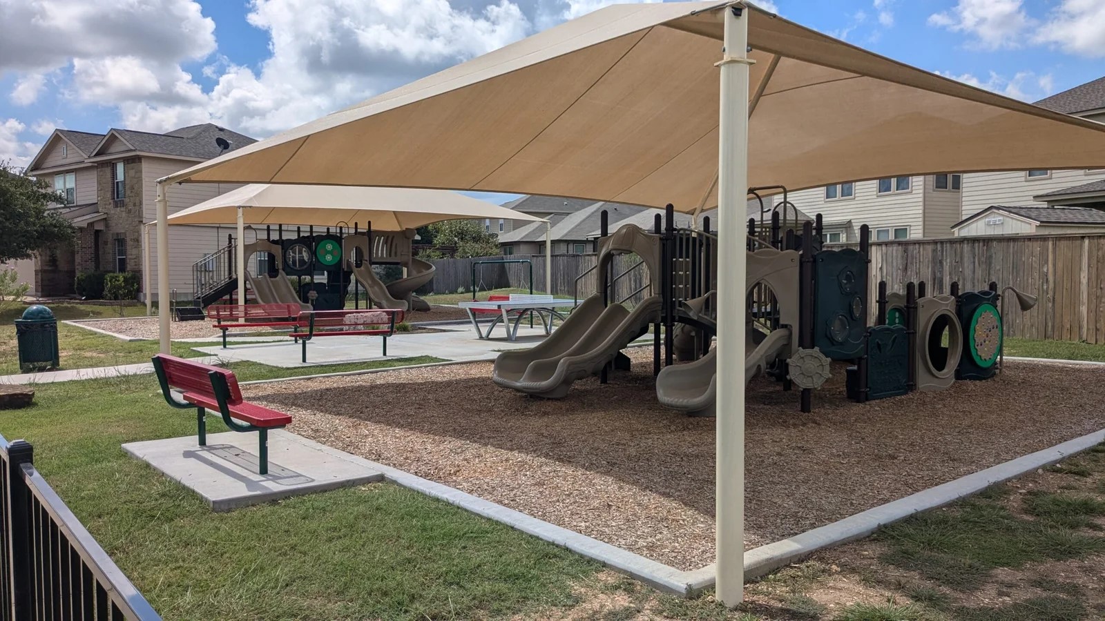 169 Marcheeta Way Leander, TX 78641 - Photo 37 of 39 Community playground featuring shade structures, benches, and various play equipment