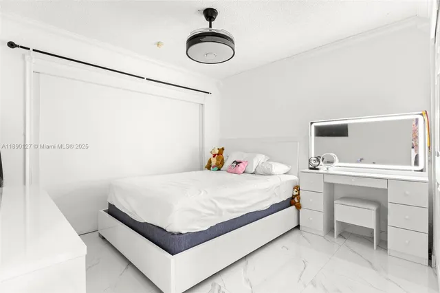 a bedroom with a bed and a table