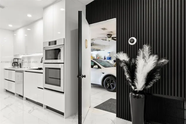 a view of cabinets and washer dryer