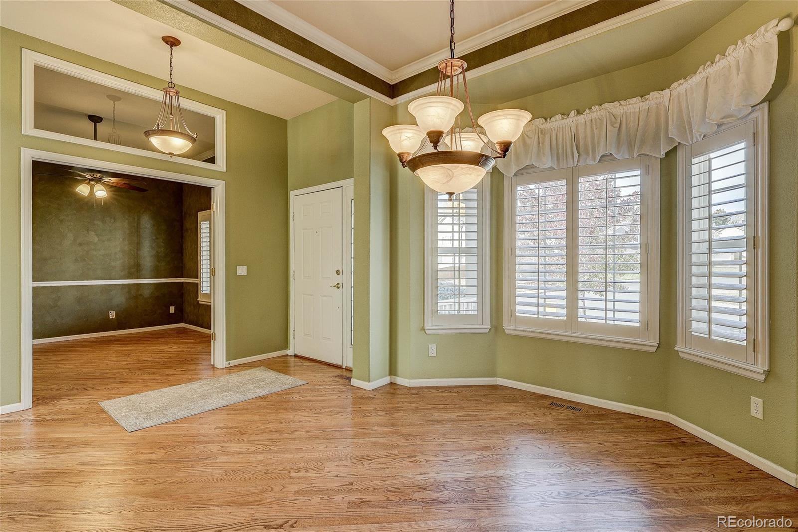 10292 South Nickolas Avenue Highlands Ranch, CO 80124 - Photo 14 of 46 a view of an entryway with a chandelier