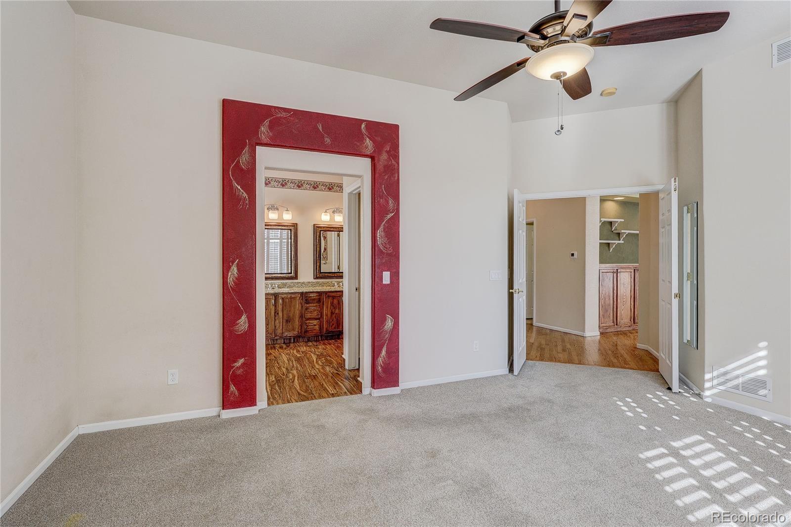 10292 South Nickolas Avenue Highlands Ranch, CO 80124 - Photo 17 of 46 a view of empty room with a ceiling fan