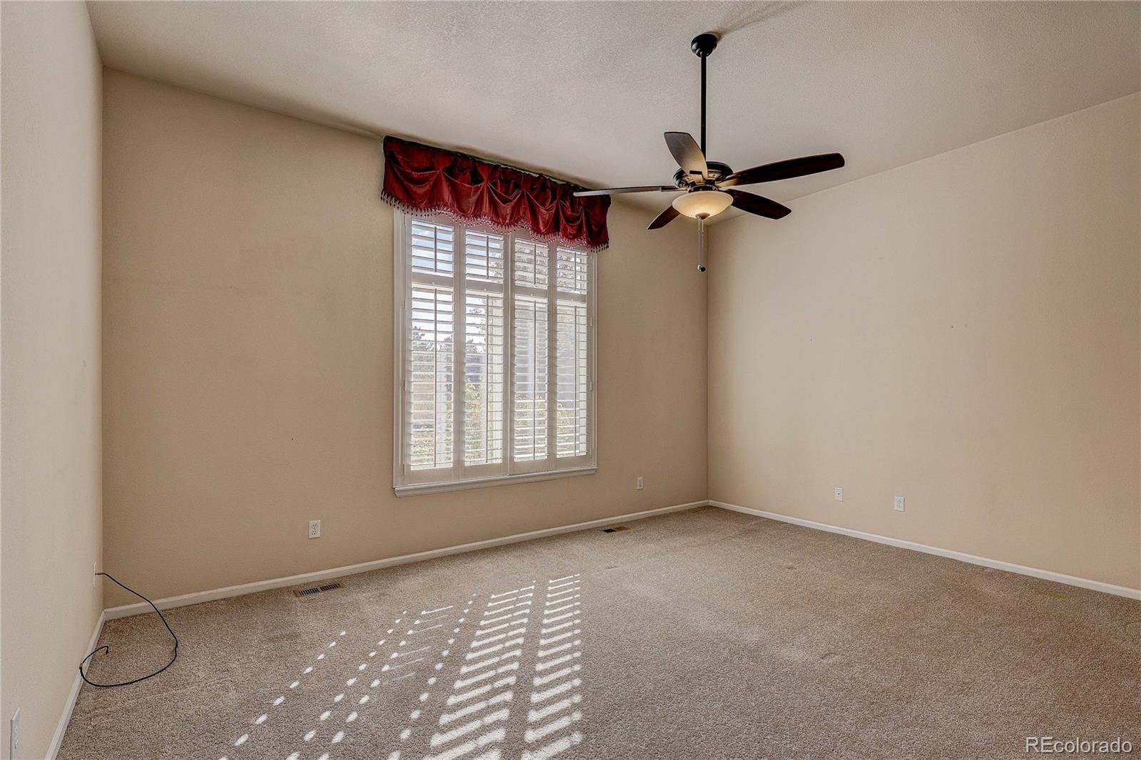 10292 South Nickolas Avenue Highlands Ranch, CO 80124 - Photo 19 of 46 a view of an empty room with a window