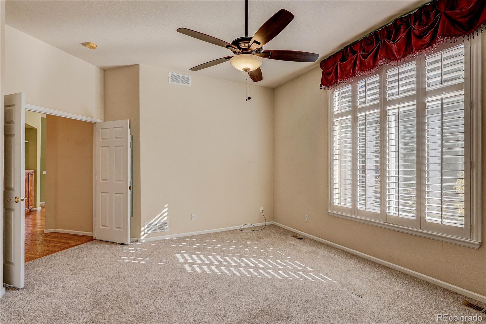 10292 South Nickolas Avenue Highlands Ranch, CO 80124 - Photo 20 of 46 a view of an empty room with a window