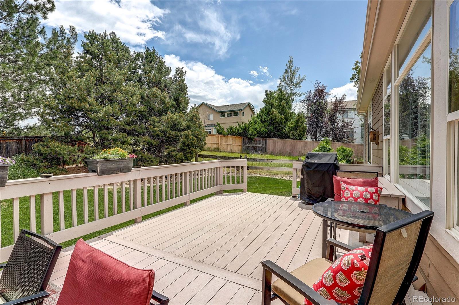 10292 South Nickolas Avenue Highlands Ranch, CO 80124 - Photo 31 of 46 a view of a tables and chairs on the roof deck