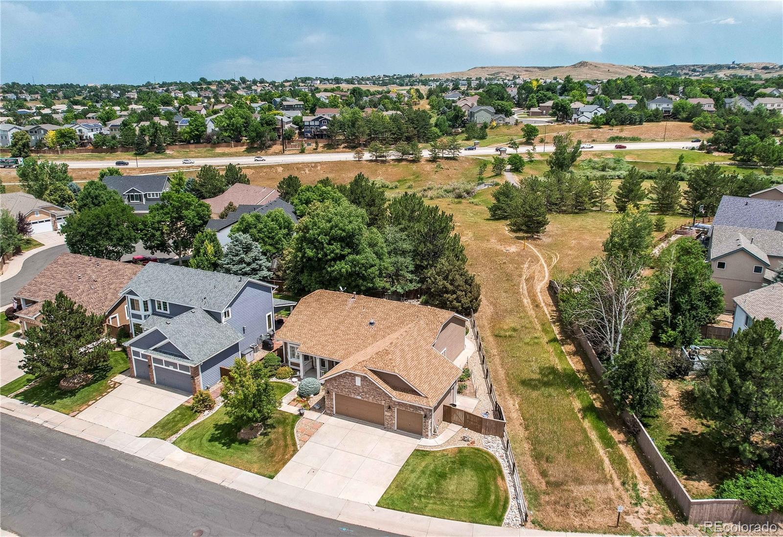 10292 South Nickolas Avenue Highlands Ranch, CO 80124 - Photo 36 of 46 an aerial view of residential houses with outdoor space and river