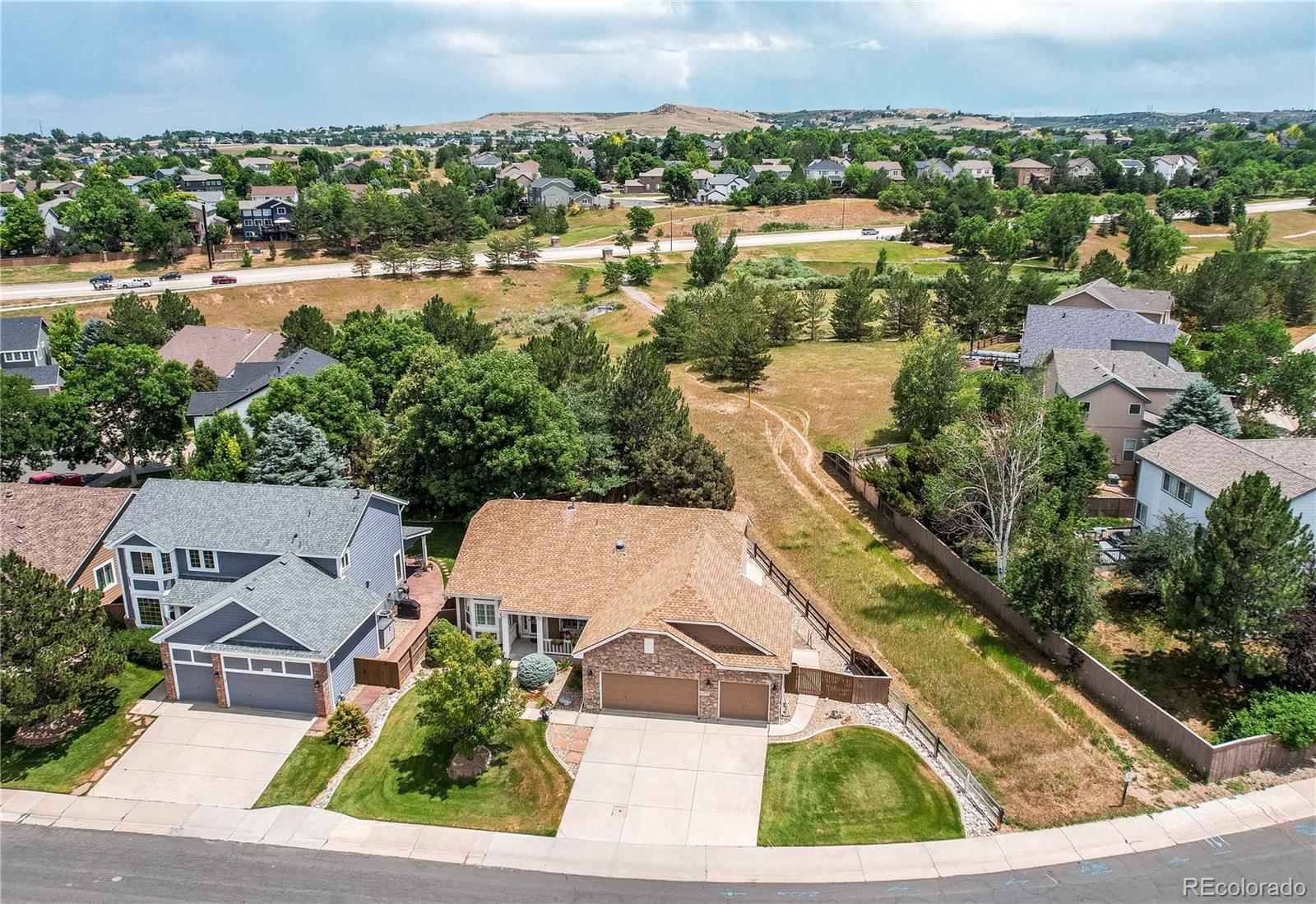 10292 South Nickolas Avenue Highlands Ranch, CO 80124 - Photo 38 of 46 an aerial view of residential houses with outdoor space and river