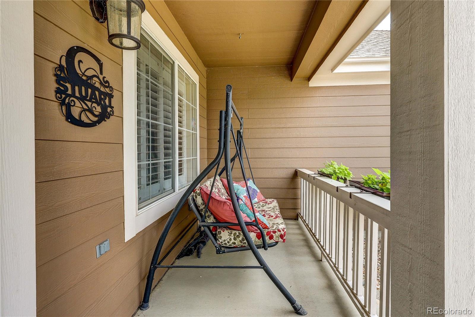 10292 South Nickolas Avenue Highlands Ranch, CO 80124 - Photo 39 of 46 a view of a wooden door with a bench