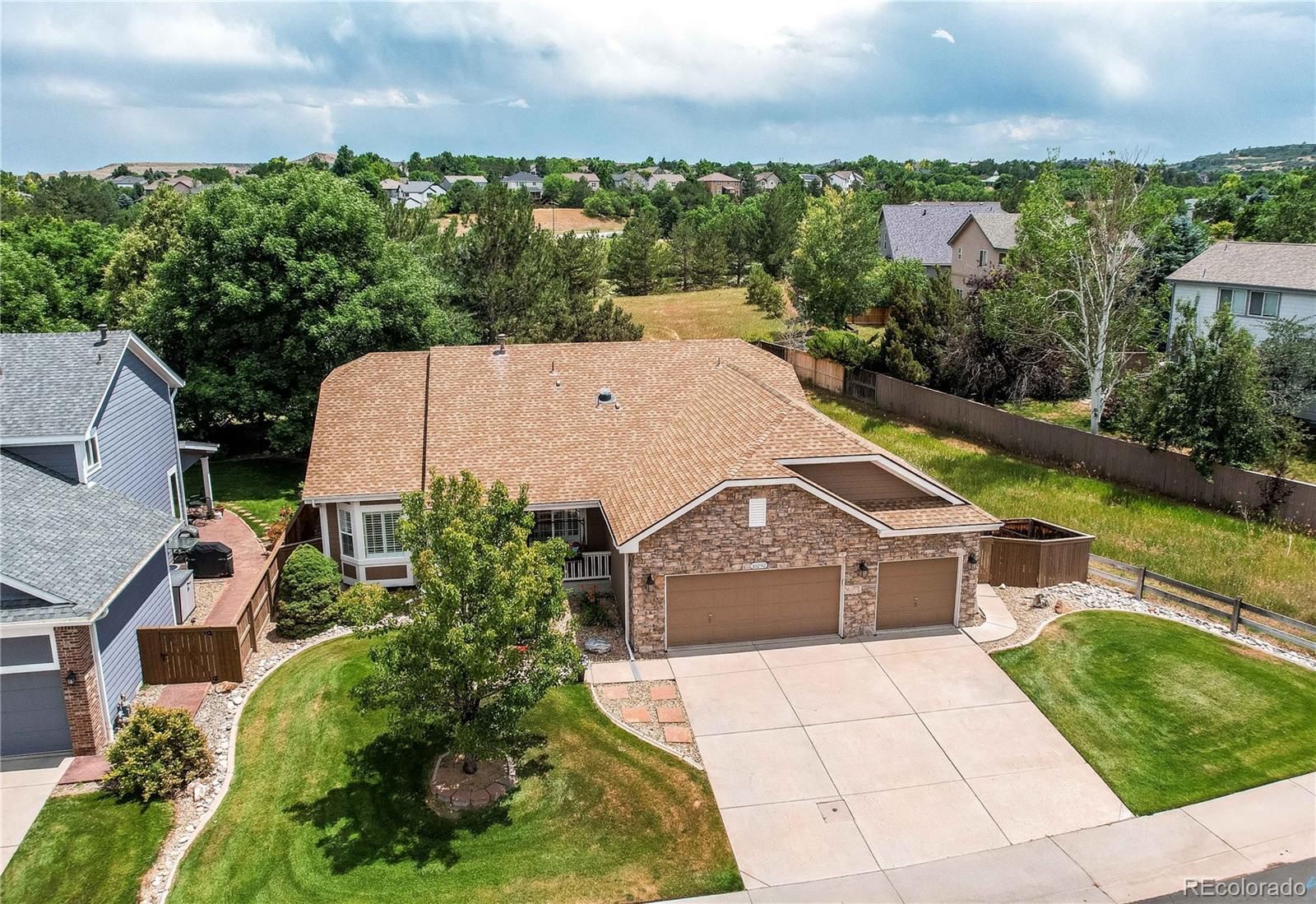 10292 South Nickolas Avenue Highlands Ranch, CO 80124 - Photo 42 of 46 an aerial view of a house with a garden