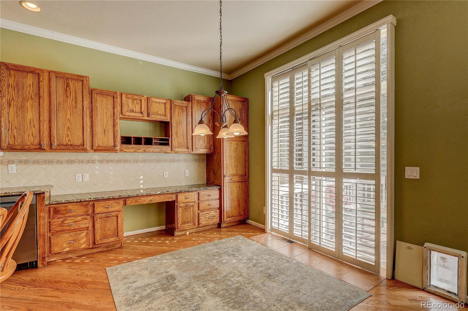 10292 South Nickolas Avenue Highlands Ranch, CO 80124 - Photo 5 of 46 a view of a kitchen with a sink and a window