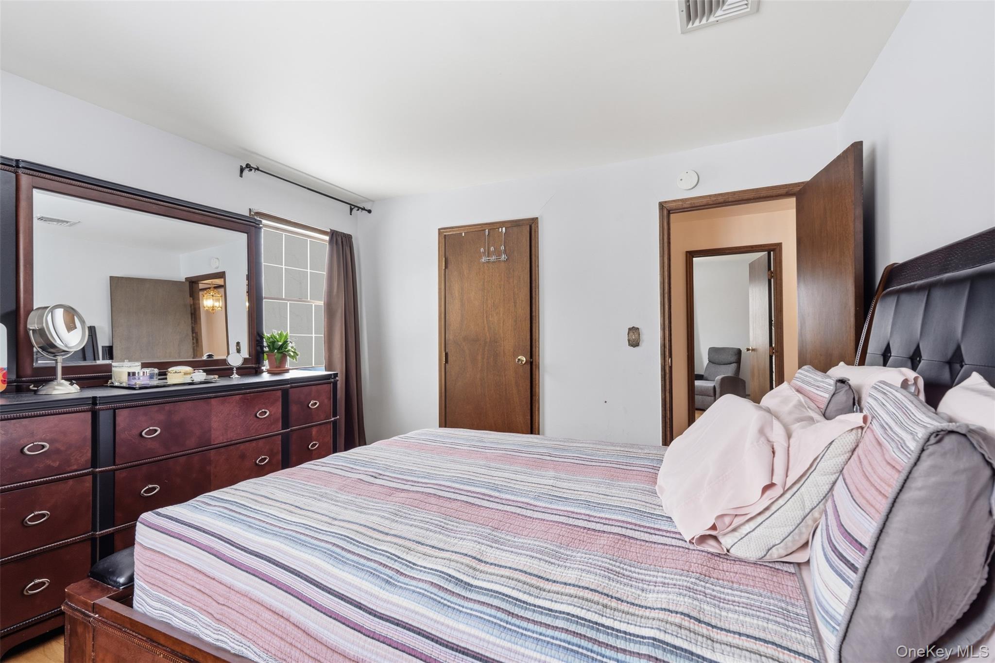 113 Buckberg Road Stony Point, NY 10986 - Photo 21 of 33 a bedroom with a bed and a large mirror on dresser